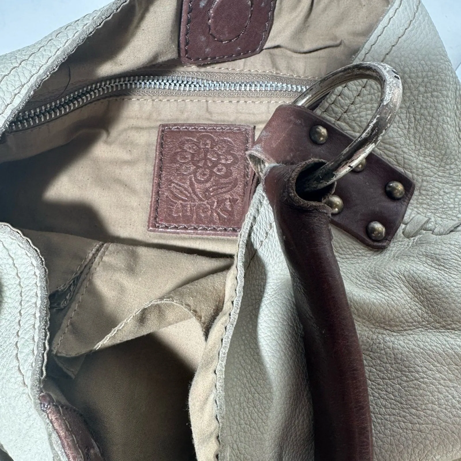 White and Brown Hobo Bag with Textured Leather and Slouchy Shape